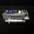 Bottom bracket axle N.O.S "SHIMANO BBUN 73" 107 mm 1.37 x 24 (Ref 479)